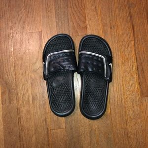 Black Nike Slides size 6 but fits like 7.